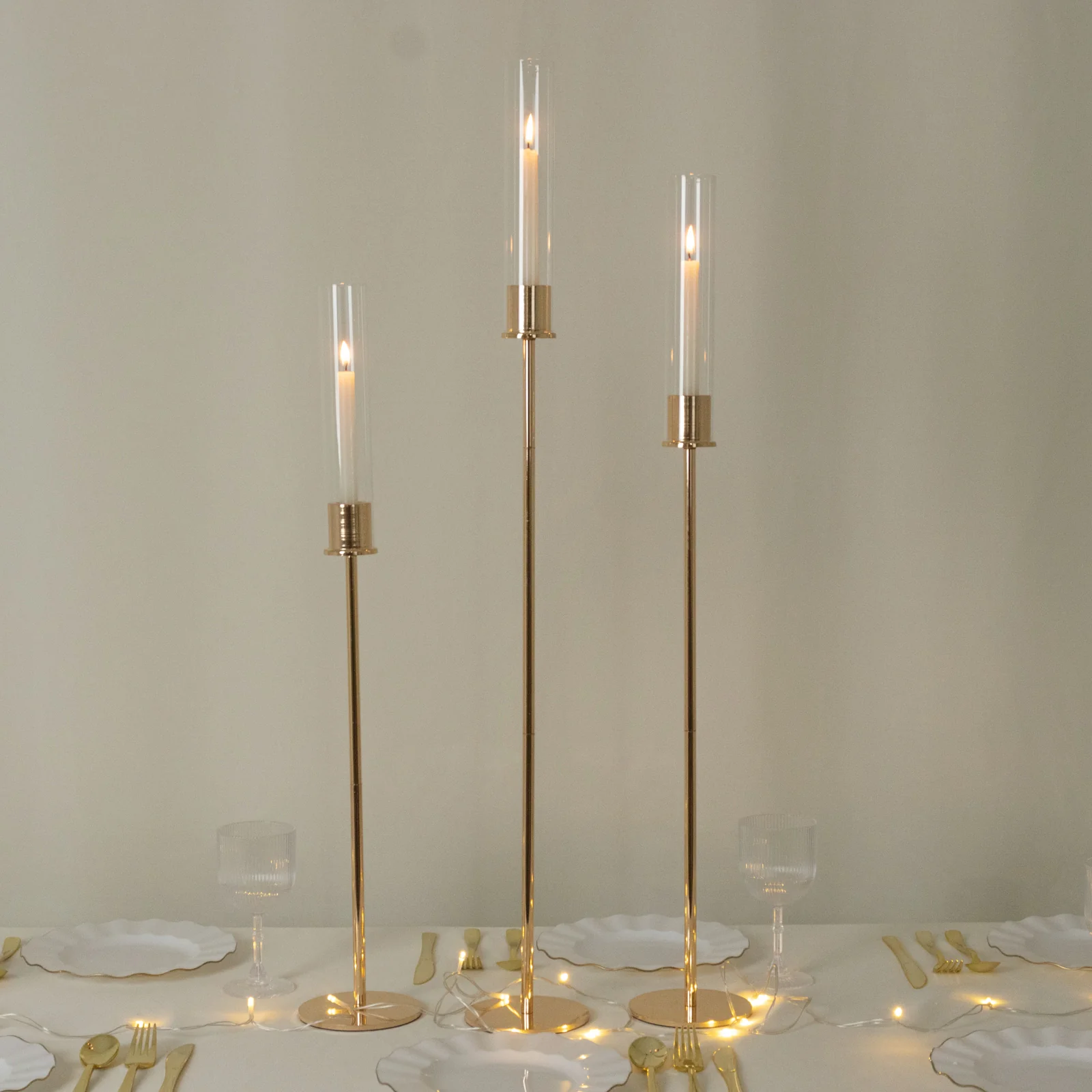 Set of 3 Gold Metal Taper Candle Holders with Hurricane Glass Shades – Modern Minimalist Candlestick Stands – 28", 32", 36"